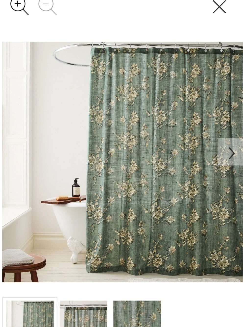 West Elm green floral shower curtain with cream and gold blooms